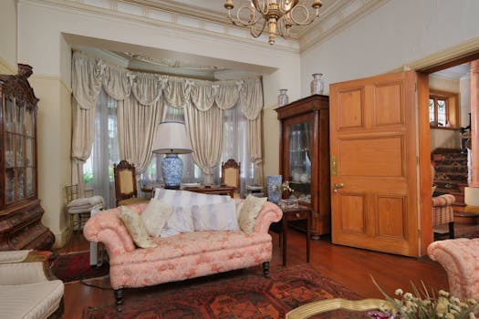 Explore the cozy and elegant vintage interior of a classic living room with plush decor and antique furniture.