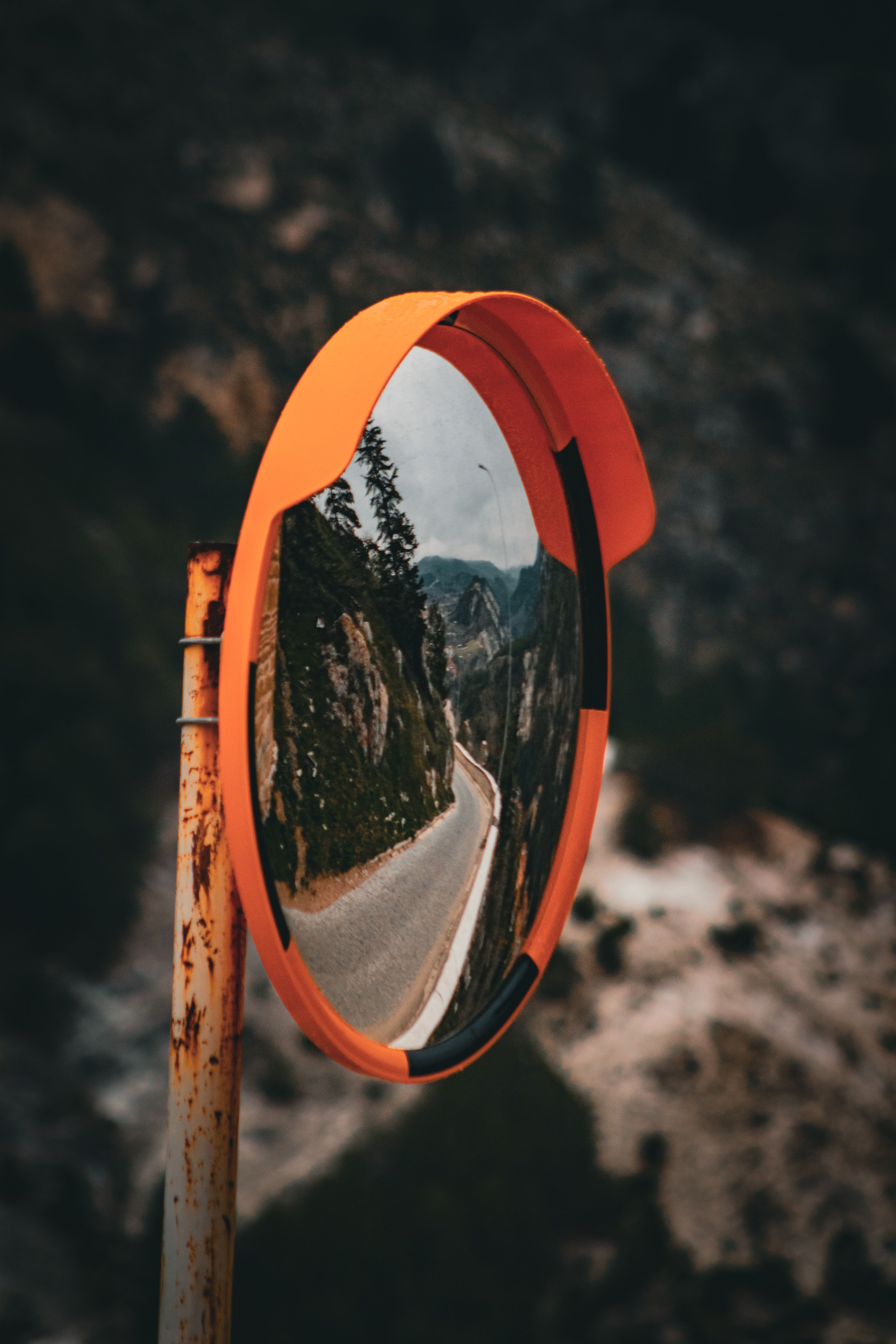 Curved Mountain Road Reflected in Mirror · Free Stock Photo