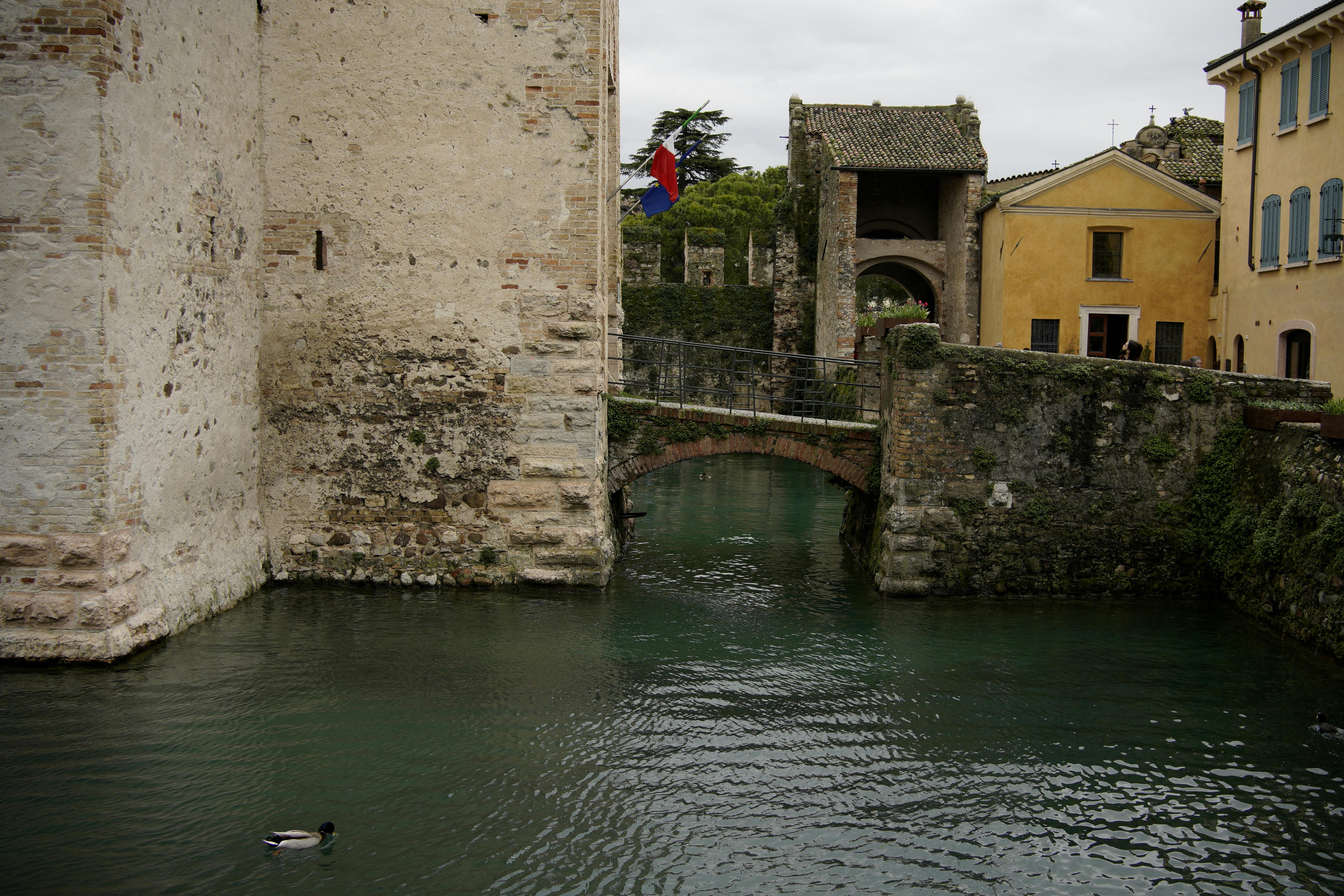 scenic view of sirmione castle and canal