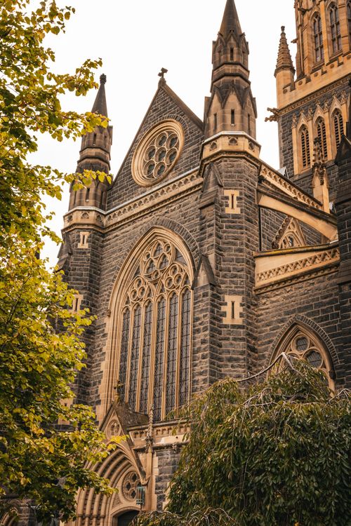 Free Stunning view of the Gothic Revival St Patrick's Cathedral in Melbourne, showcasing intricate stonework and towering spires. Stock Photo