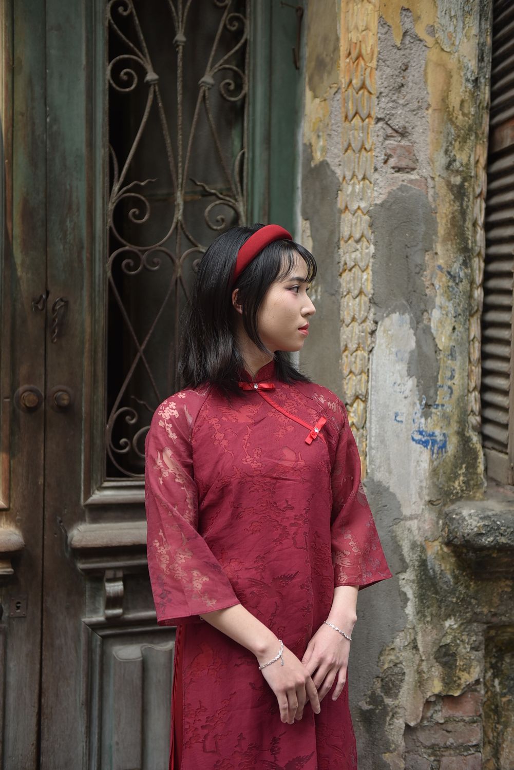 Elegant Woman in Traditional Red Dress Near Vintage Door · Free Stock Photo
