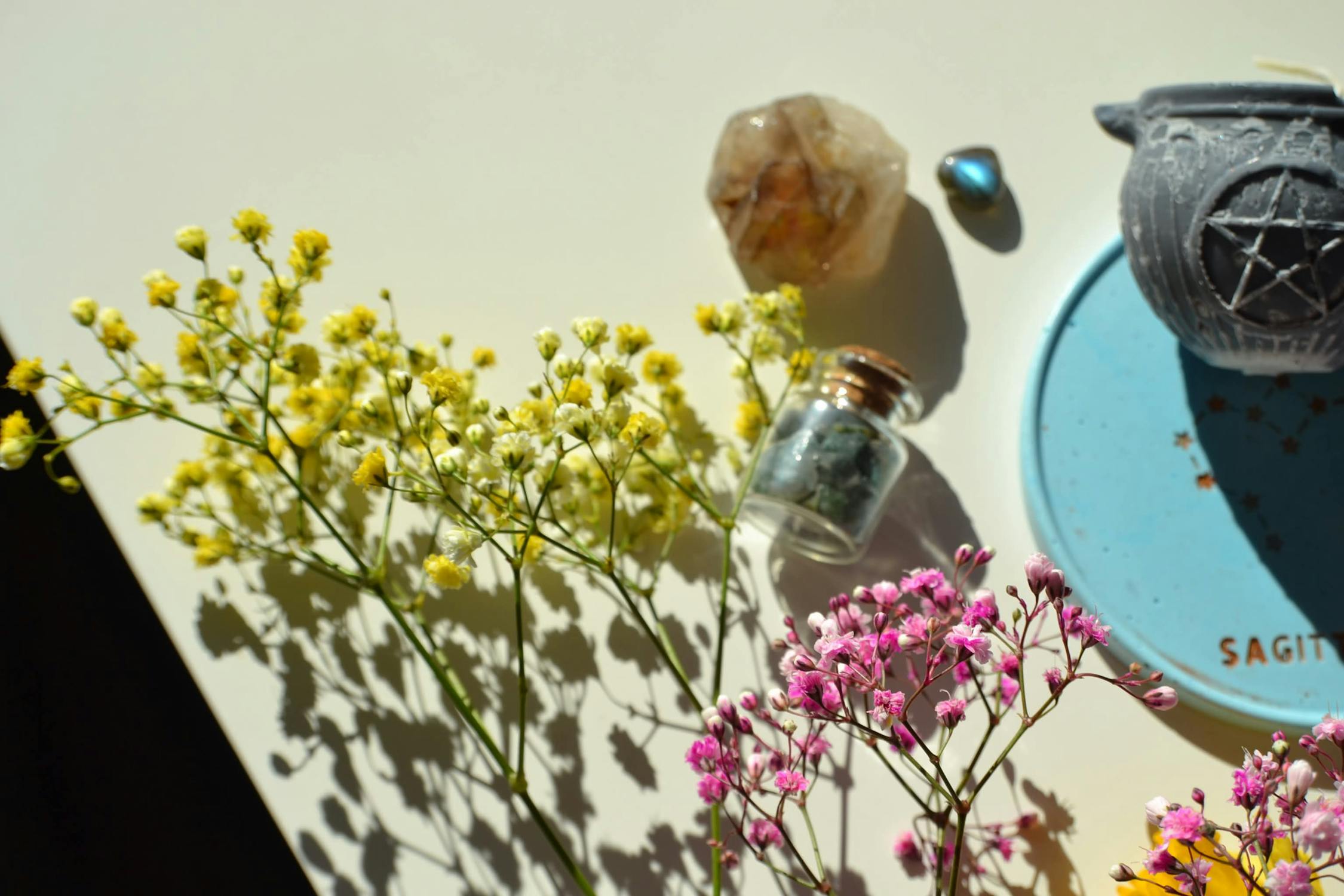 herbs and bottle with crystals