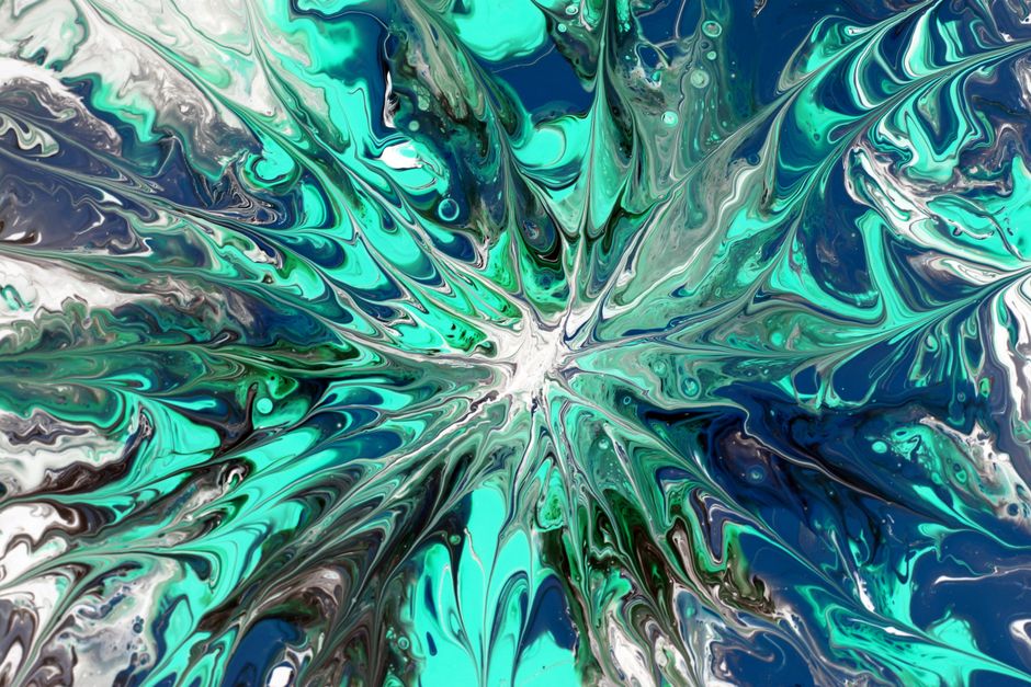 Dynamic abstract fluid art featuring a splash of blue, green, and white colors, creating a vibrant and energetic visual experience.
