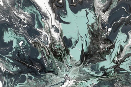 Dynamic abstract fluid art with black, white, and green swirling patterns.