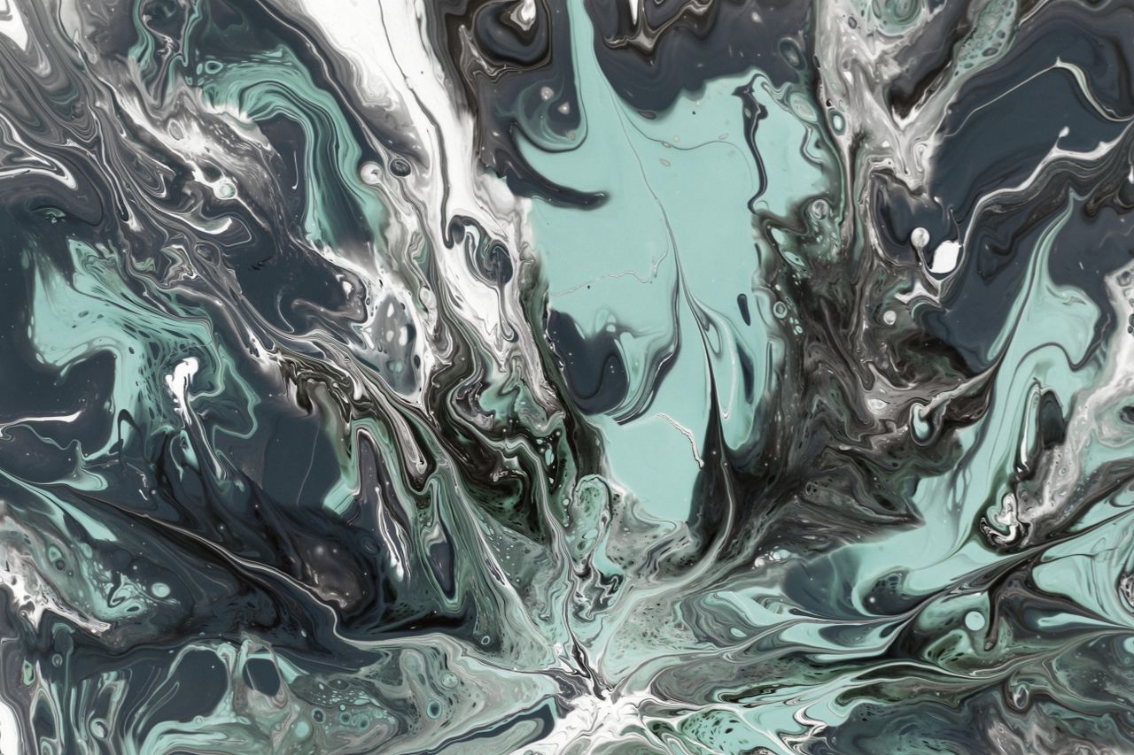 dynamic abstract fluid art with black white and green swirling pattern
