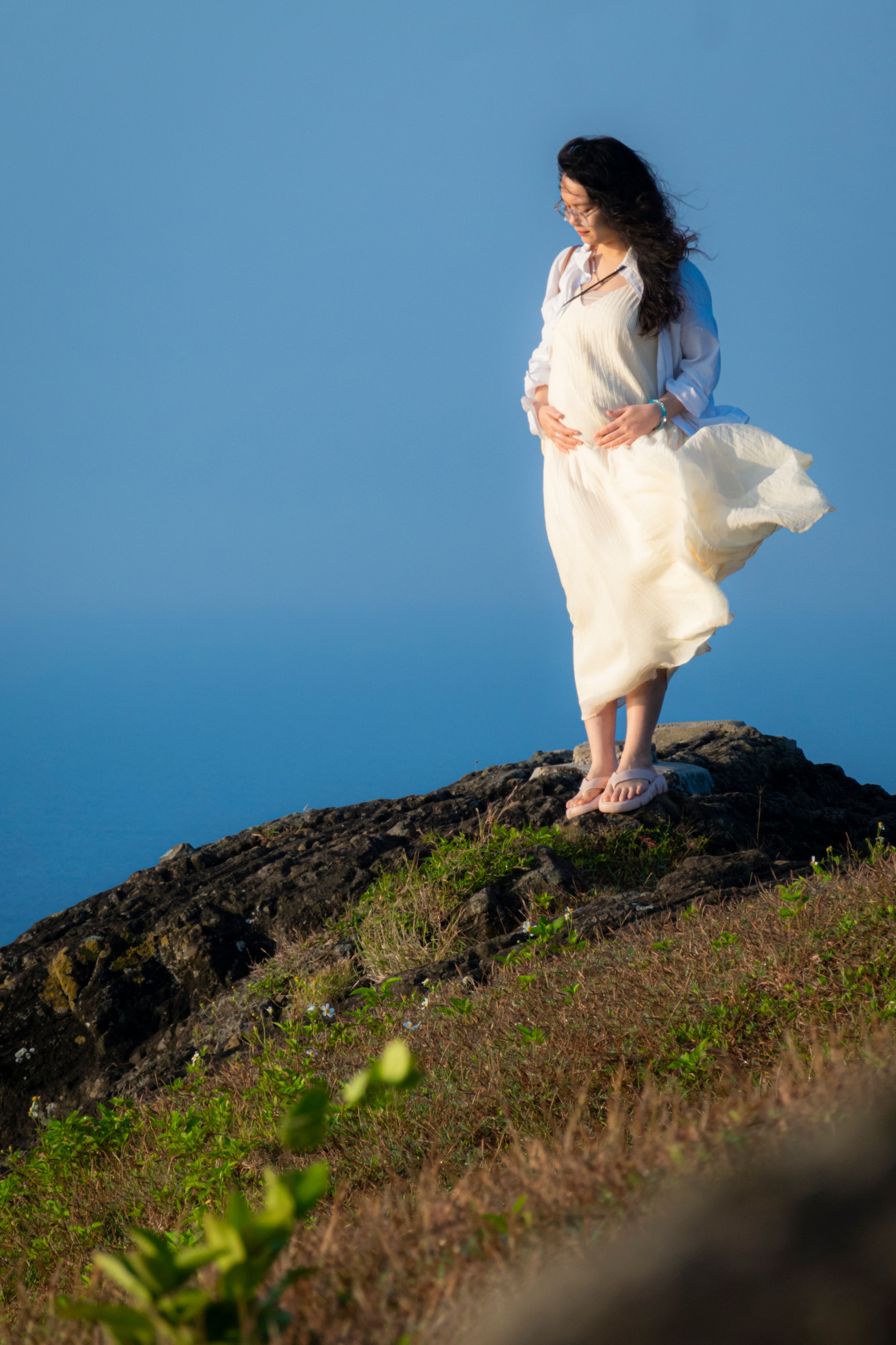 Woman in White Dress Standing on Cliffside · Free Stock Photo
