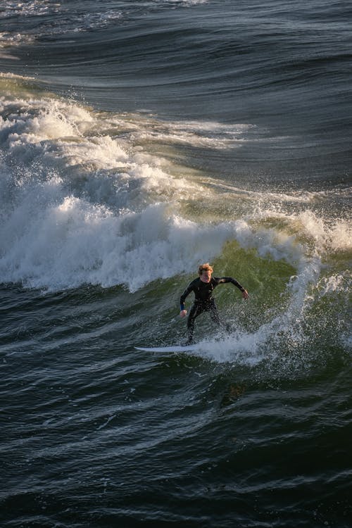 Man Surfing on Sea