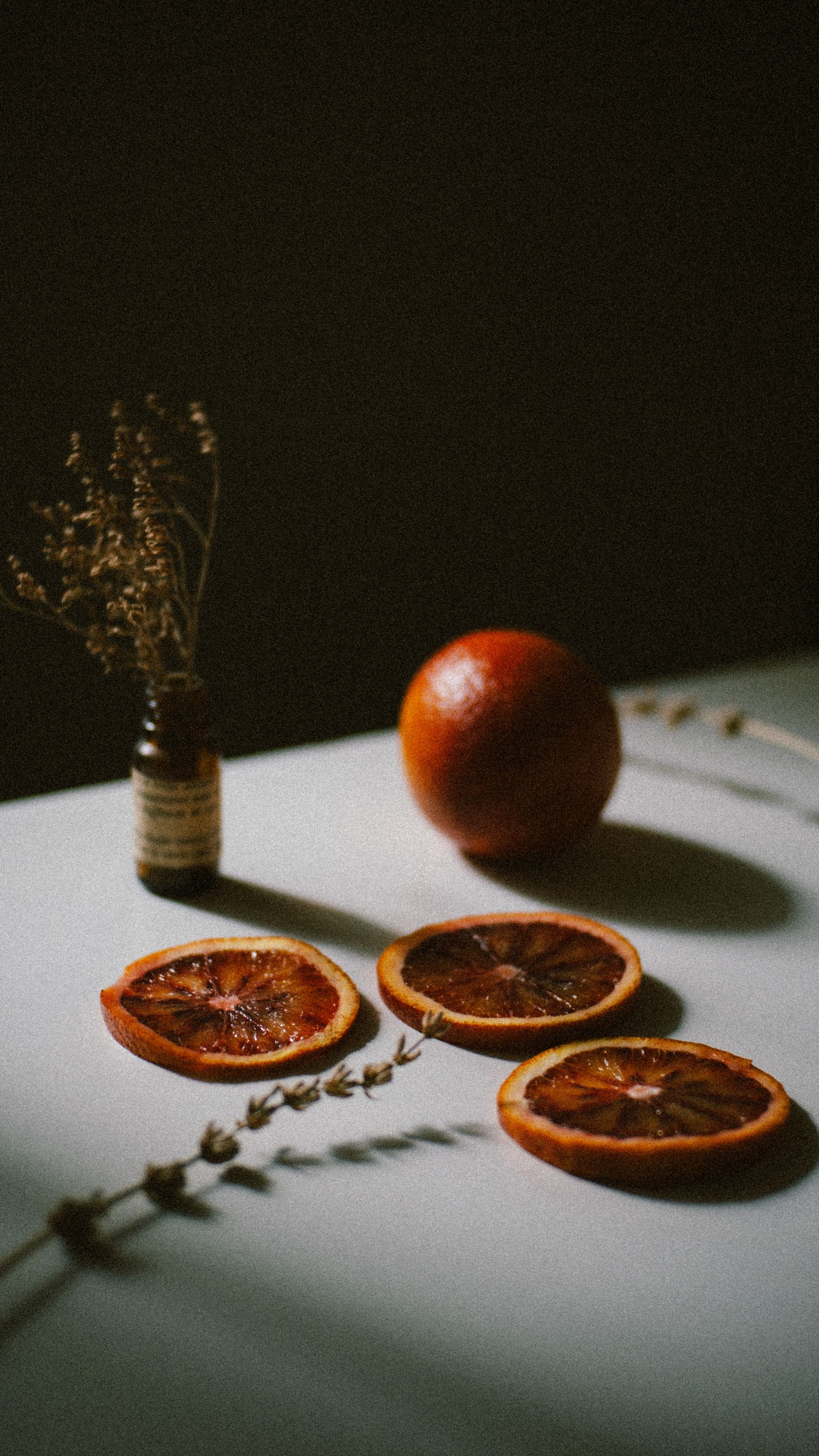 Artistic still life with dried oranges and herbs for liver detox for hormonal balance and gentle wellness support