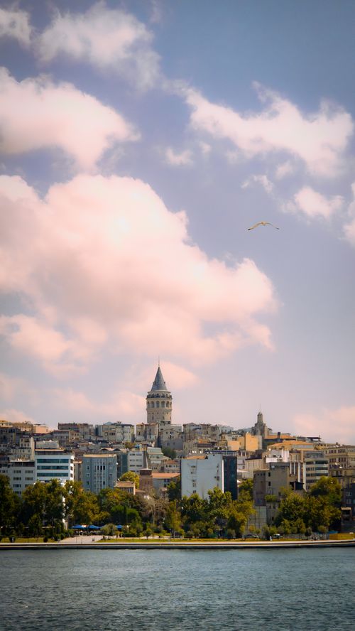 Free A picturesque view of Galata Tower and Istanbul skyline with fluffy clouds in the background. Stock Photo