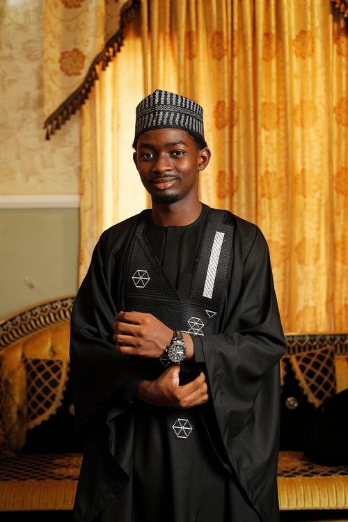 Free Portrait of a man in traditional Hausa attire indoors in Abuja, Nigeria. Stock Photo