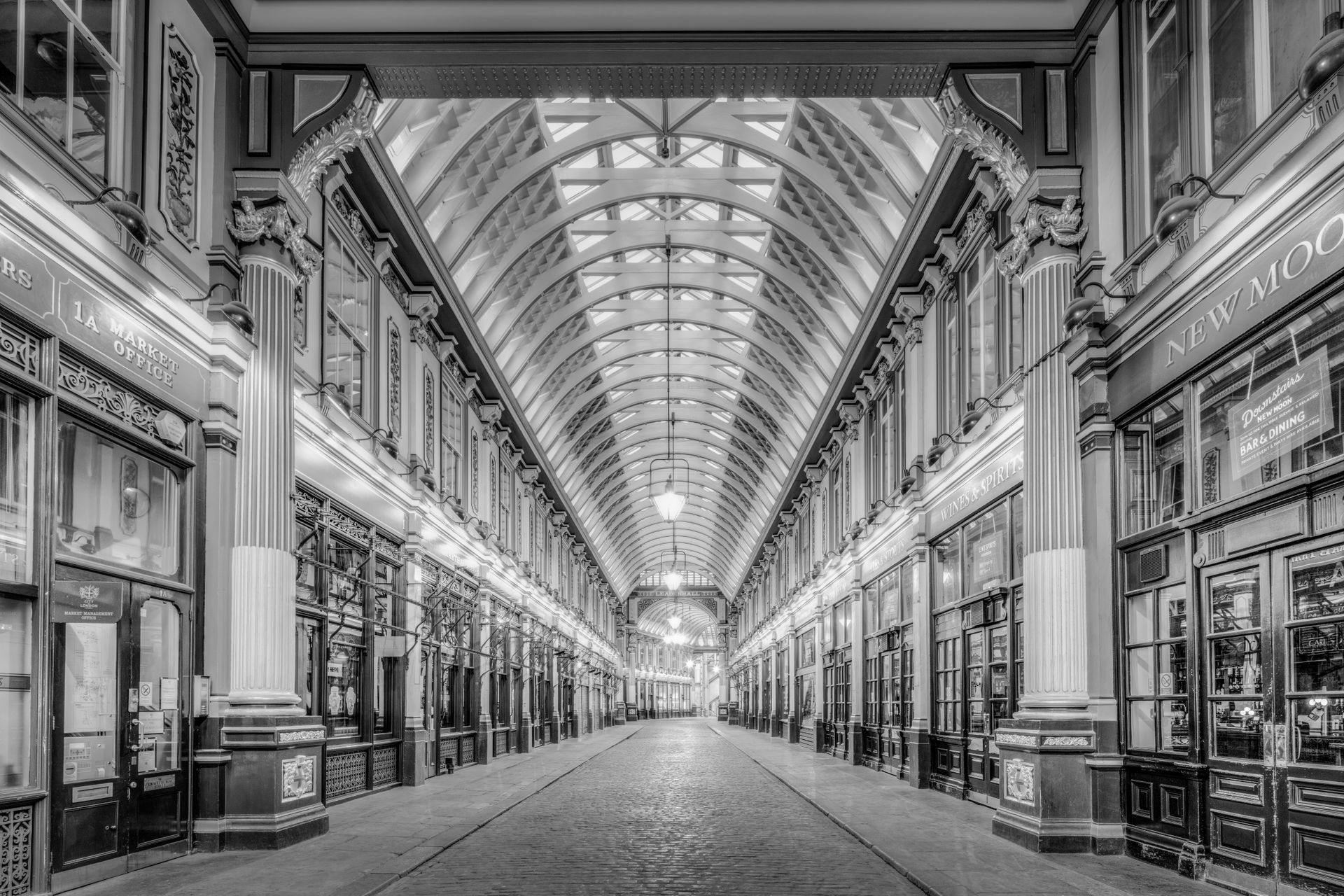 A classic monochrome view of the historic Leadenhall Market's stunning architecture in London, UK.