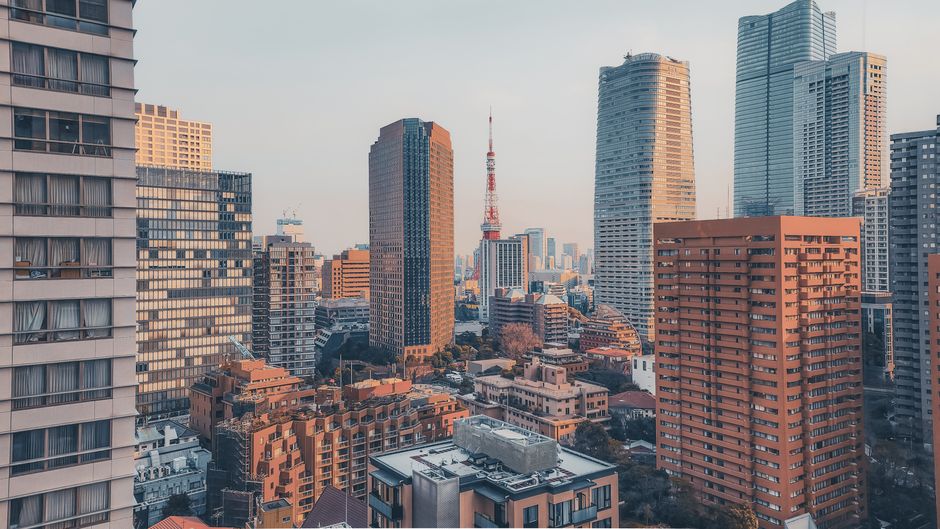 Vibrant view of Tokyo's cityscape featuring the iconic Tokyo Tower during daylight.