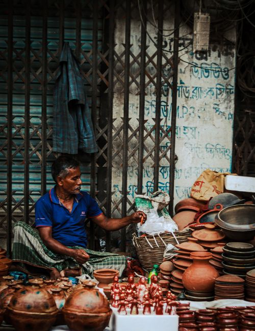 Free A man selling traditional clay pottery and figurines on the streets of Bangladesh. Stock Photo