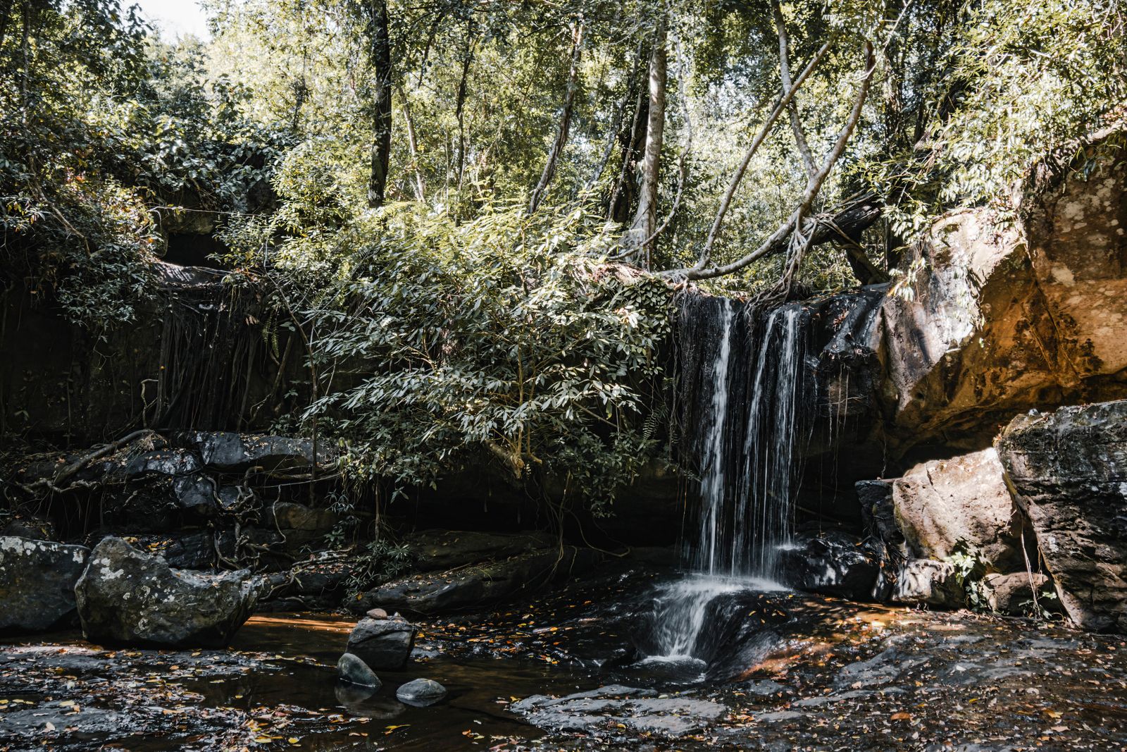 Waterfall cascading through dense forest in the Cardamom Mountains, Kampong Speu, Cambodia