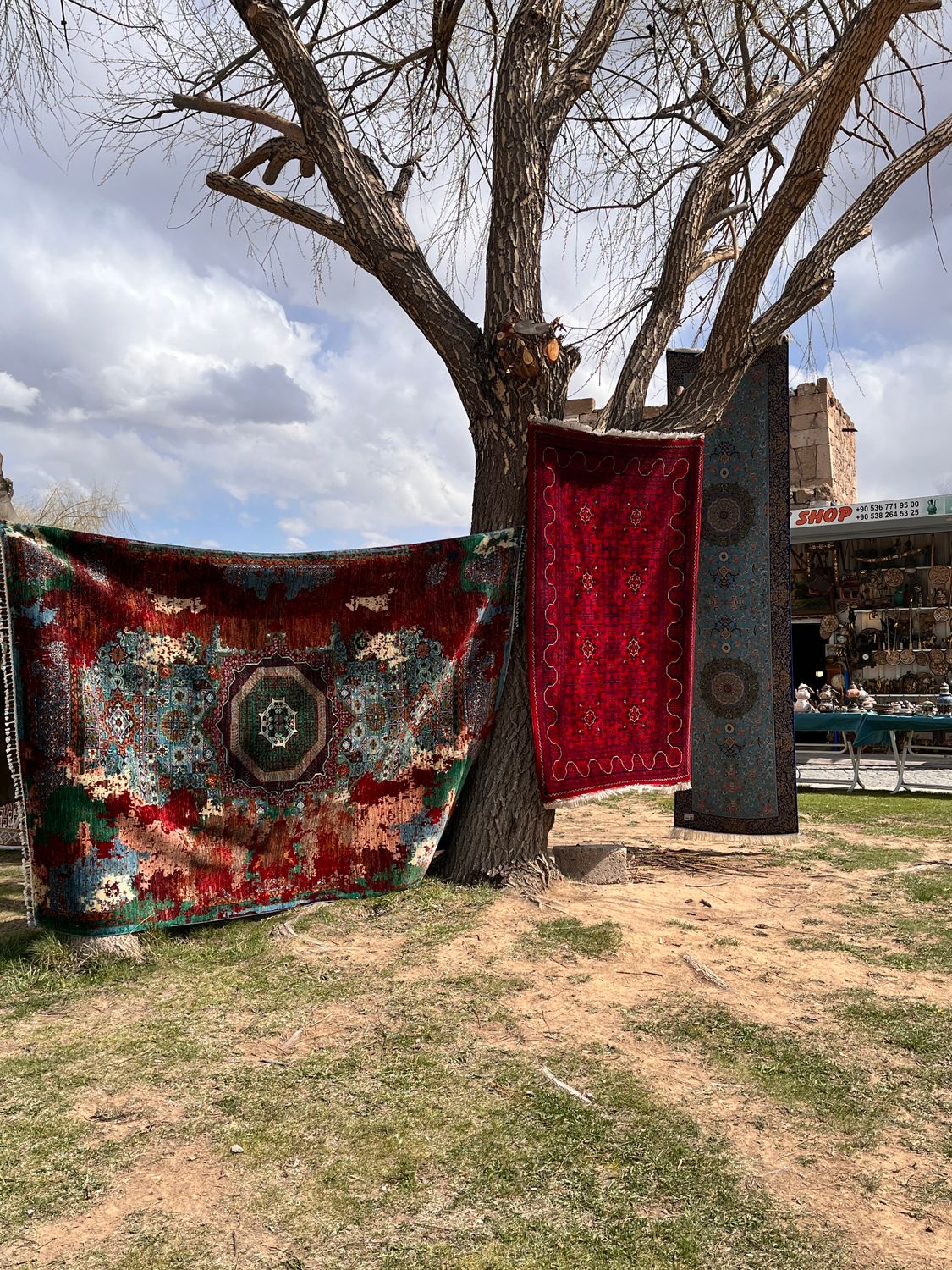Colorful Turkish Rugs Hanging Outdoors in Cappadocia · Free Stock Photo