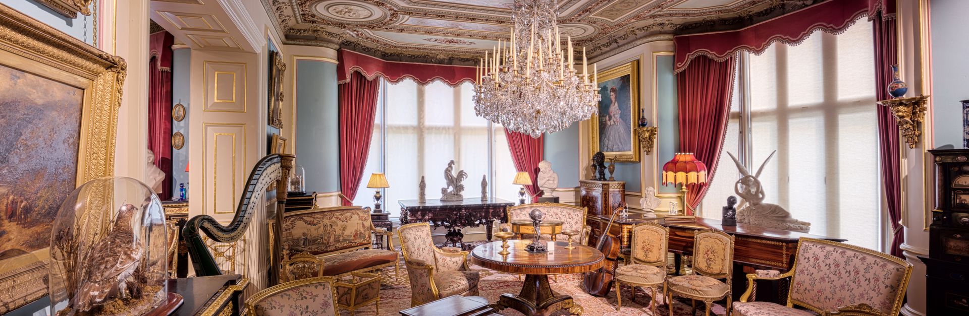 Stunning Victorian-era interior at Cliffe Castle in England, showcasing ornate design and vintage fu
