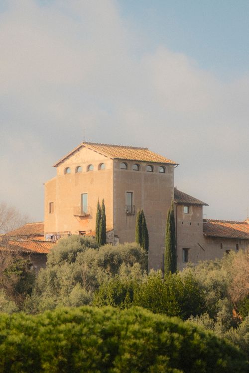 Free Charming rustic Italian villa with terracotta roof nestled among olive trees. Stock Photo