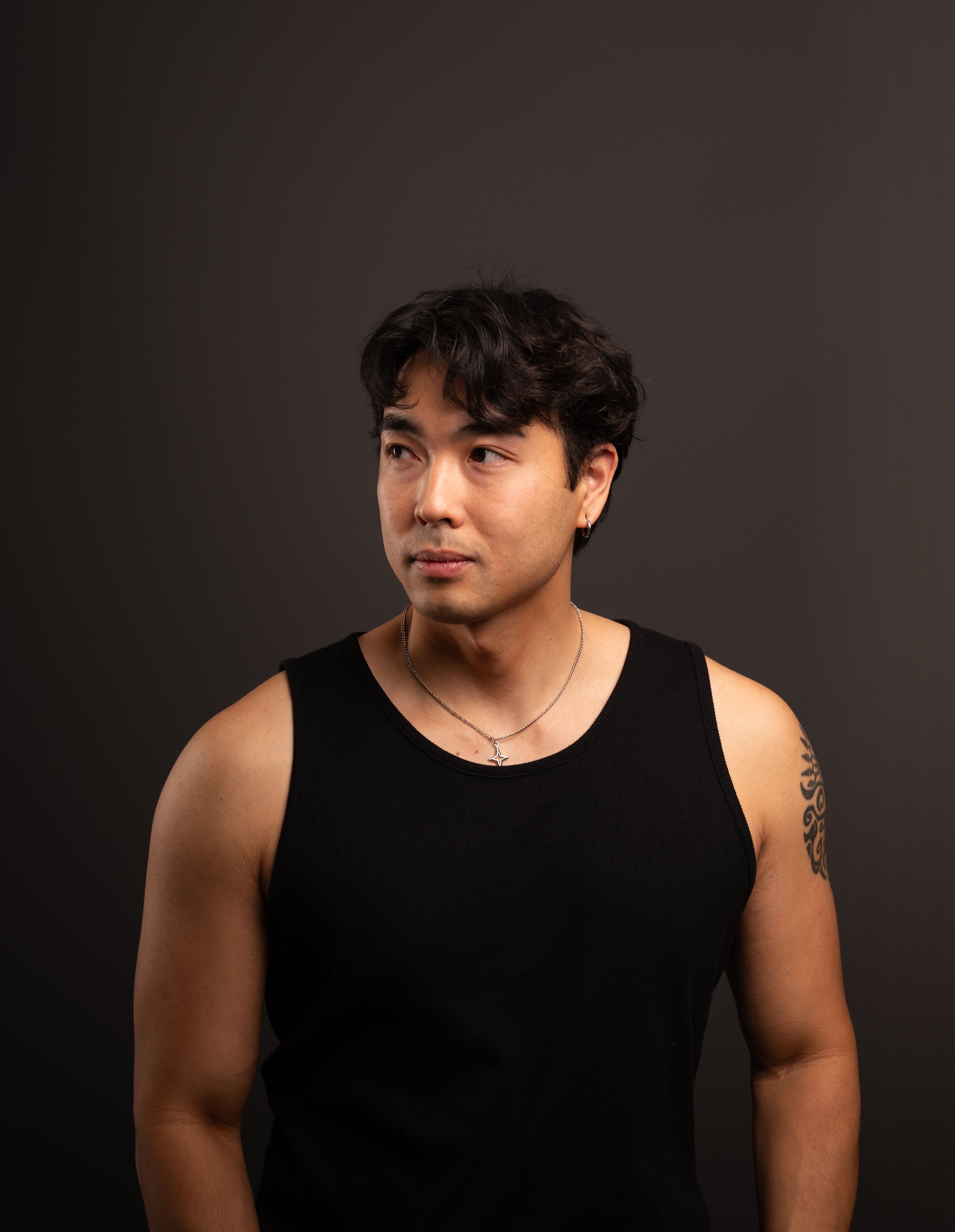 Portrait of a Young Man in Black Tank Top · Free Stock Photo