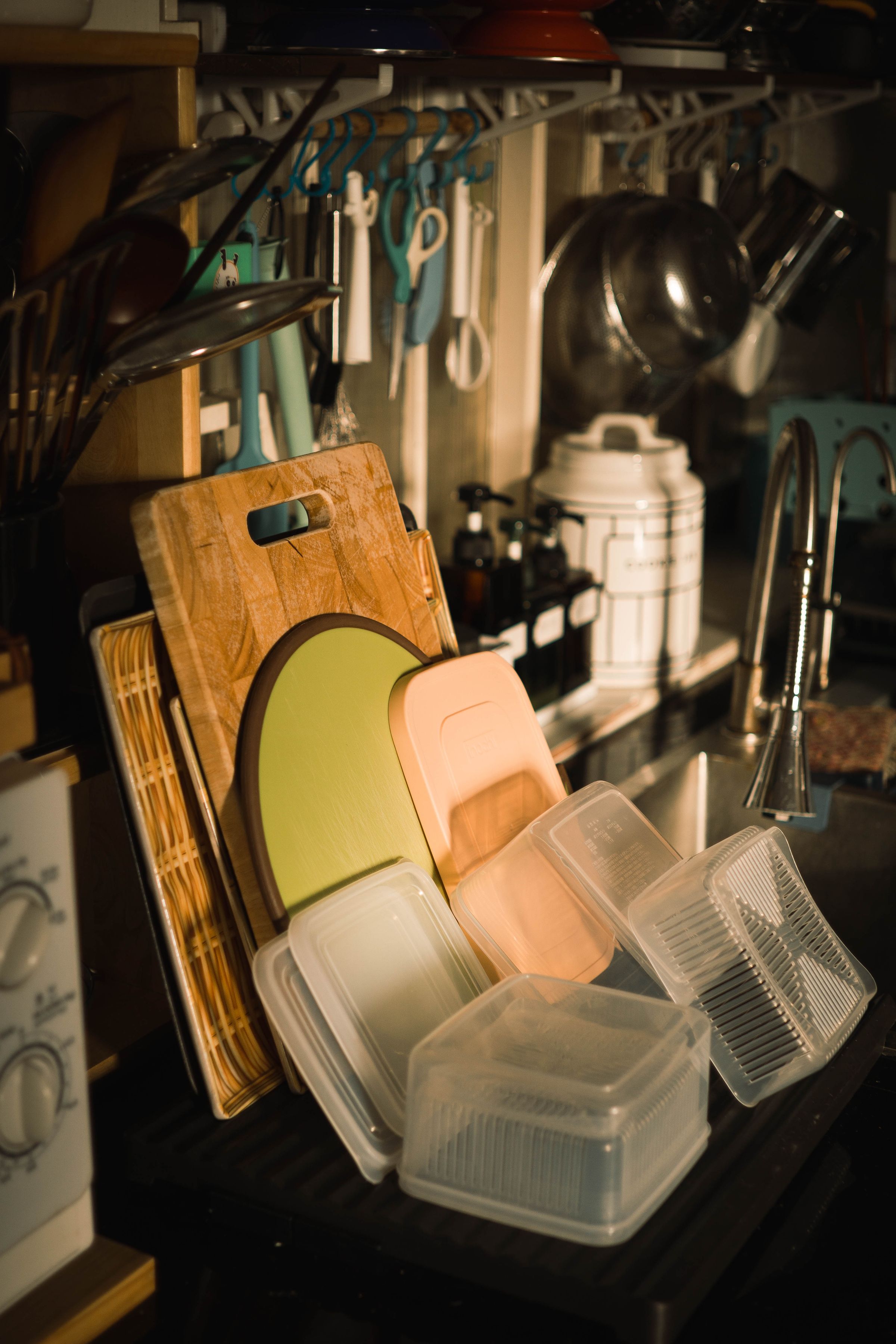 Bright kitchen storage beside a tidy sink