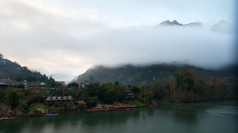 Mist rising over the river and mountains near Nong Khiaw, part of Laos's dispersed geography behind why a free Laos dating site needs a countrywide search