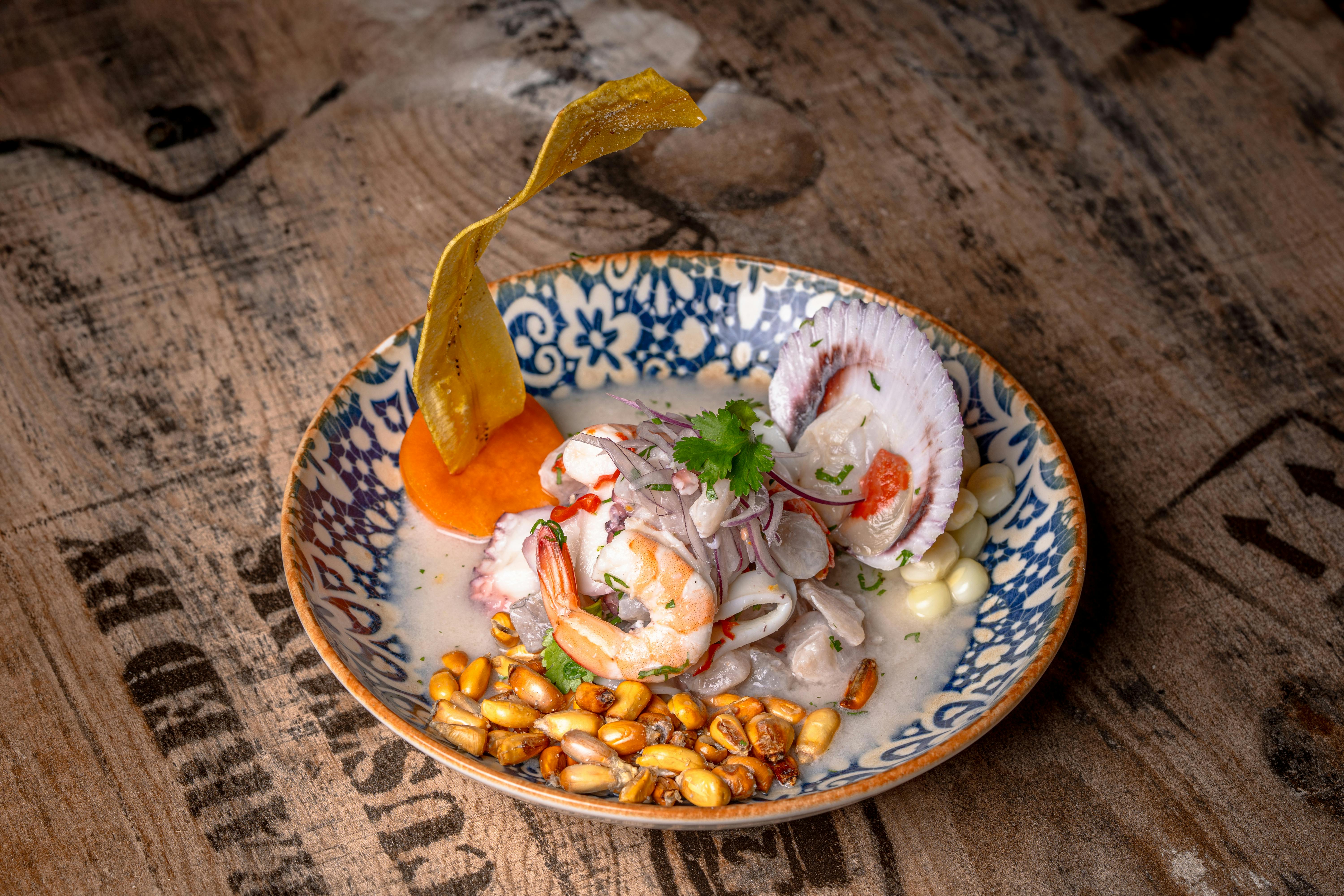 Traditional Peruvian Ceviche with Shellfish and Corn · Free Stock Photo