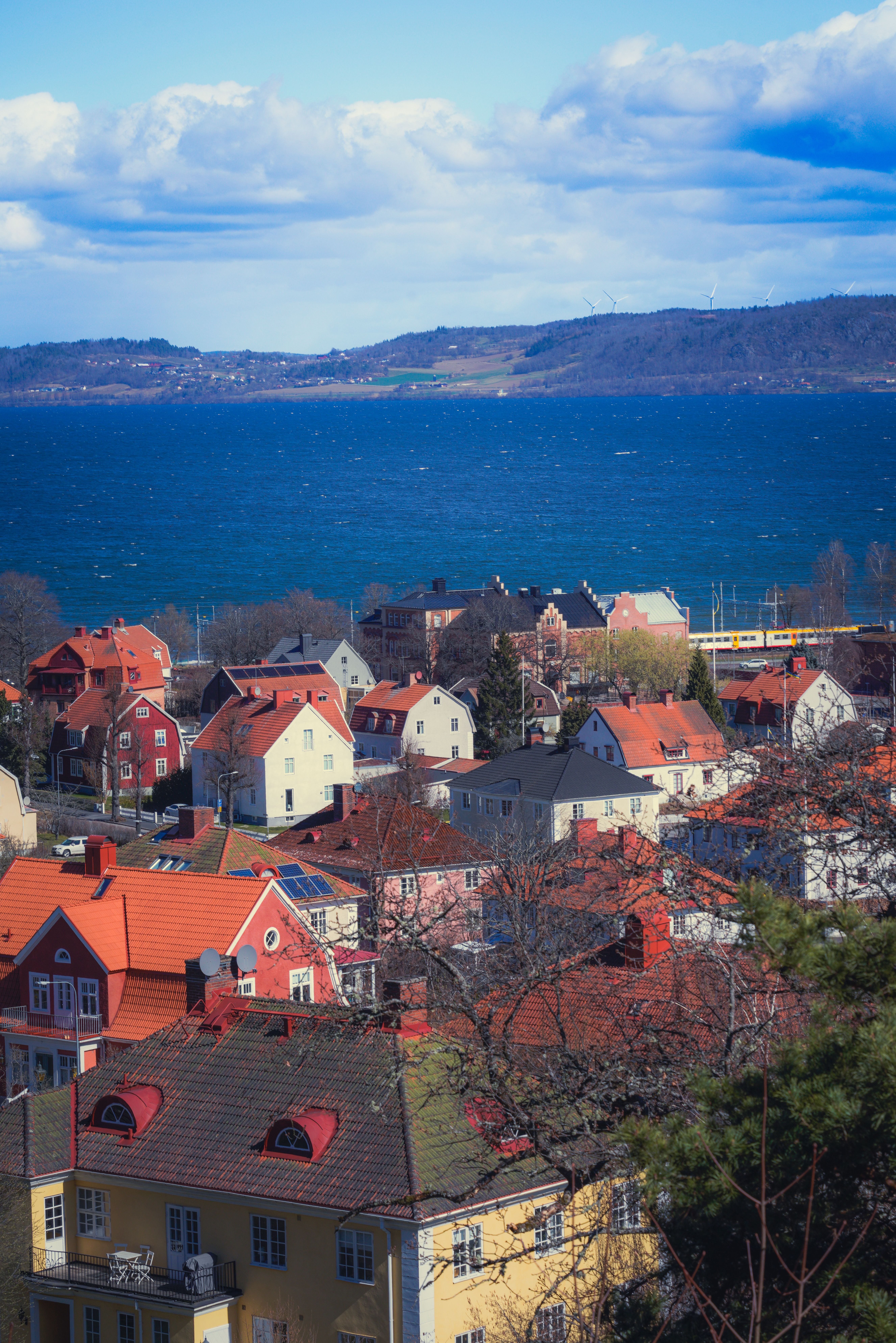 Scenic Coastal Town Overlooking Blue Ocean Waters · Free Stock Photo