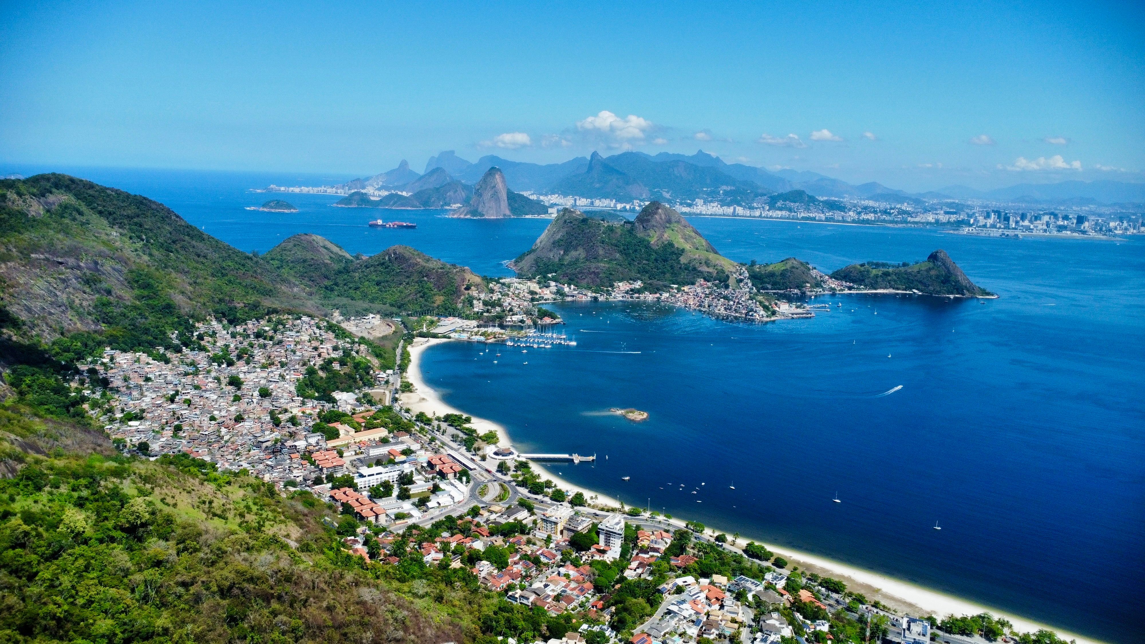 Stunning Rio de Janeiro: 35 Min Helicopter Tour Christ the Redeemer Review Review 2026 - Breathtaking aerial shot of Rio de Janeiro view. Explore lush hills and vibrant cityscape by the sea.