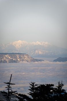 Capture of stunning mountain landscape with clouds over Leshan, China. Perfect for nature and travel themes.