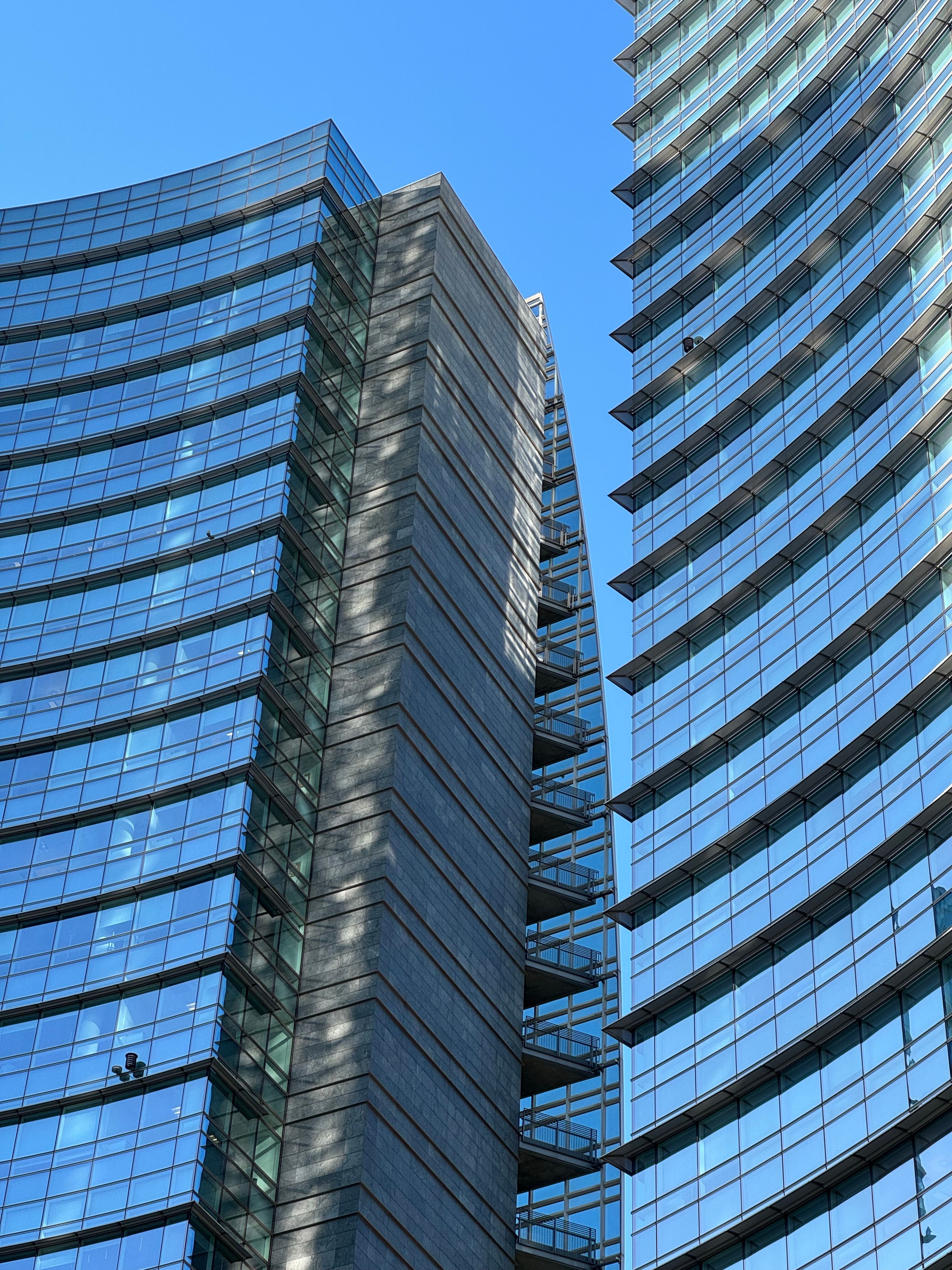 Modern Glass Skyscrapers Against Clear Blue Sky · Free Stock Photo