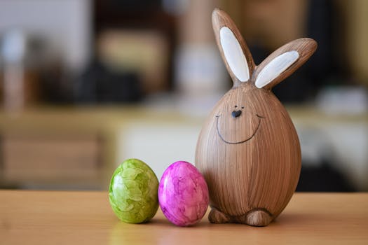 Charming wooden bunny figurine with vibrant green and pink Easter eggs, perfect for seasonal decor.