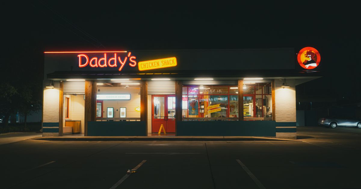 fast food drive thru menu board at night