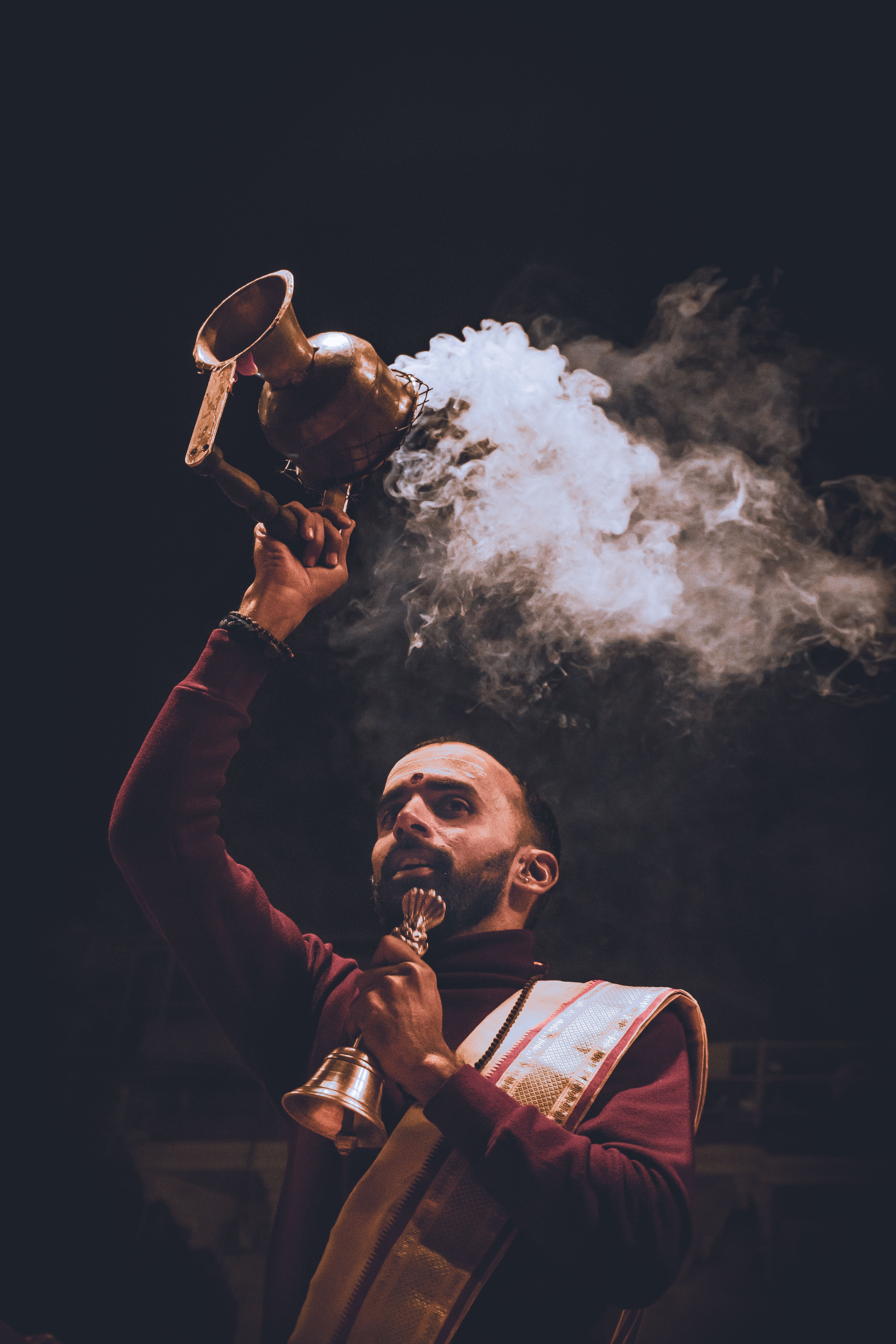 Priest Performing Ritual with Incense Vessel · Free Stock Photo