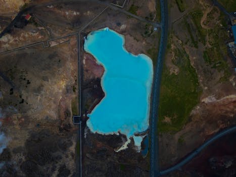 A breathtaking aerial photo of the vibrant blue waters of the Blue Lagoon in Þingeyjarsveit, Iceland.
