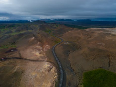 Aerial shot of the barren and rugged terrain of Þingeyjarsveit, Iceland. Ideal for travel and adventure imagery.
