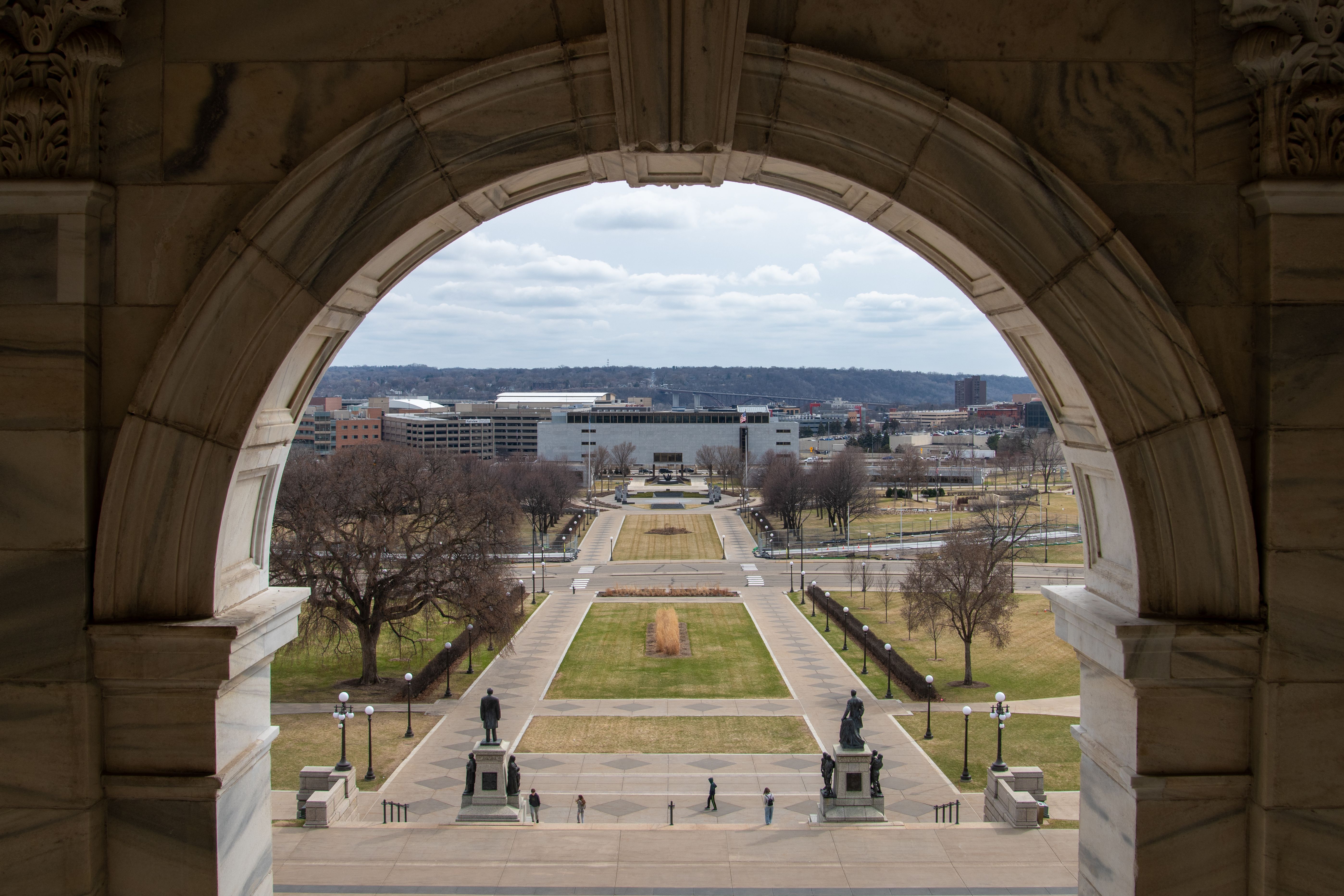A scenic view through an arch at the State Capitol in Saint Paul, Minnesota during the day.