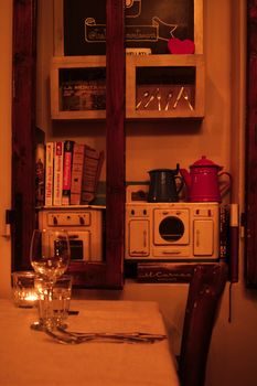 Warmly lit Italian restaurant interior showcasing vintage decor and cozy atmosphere.