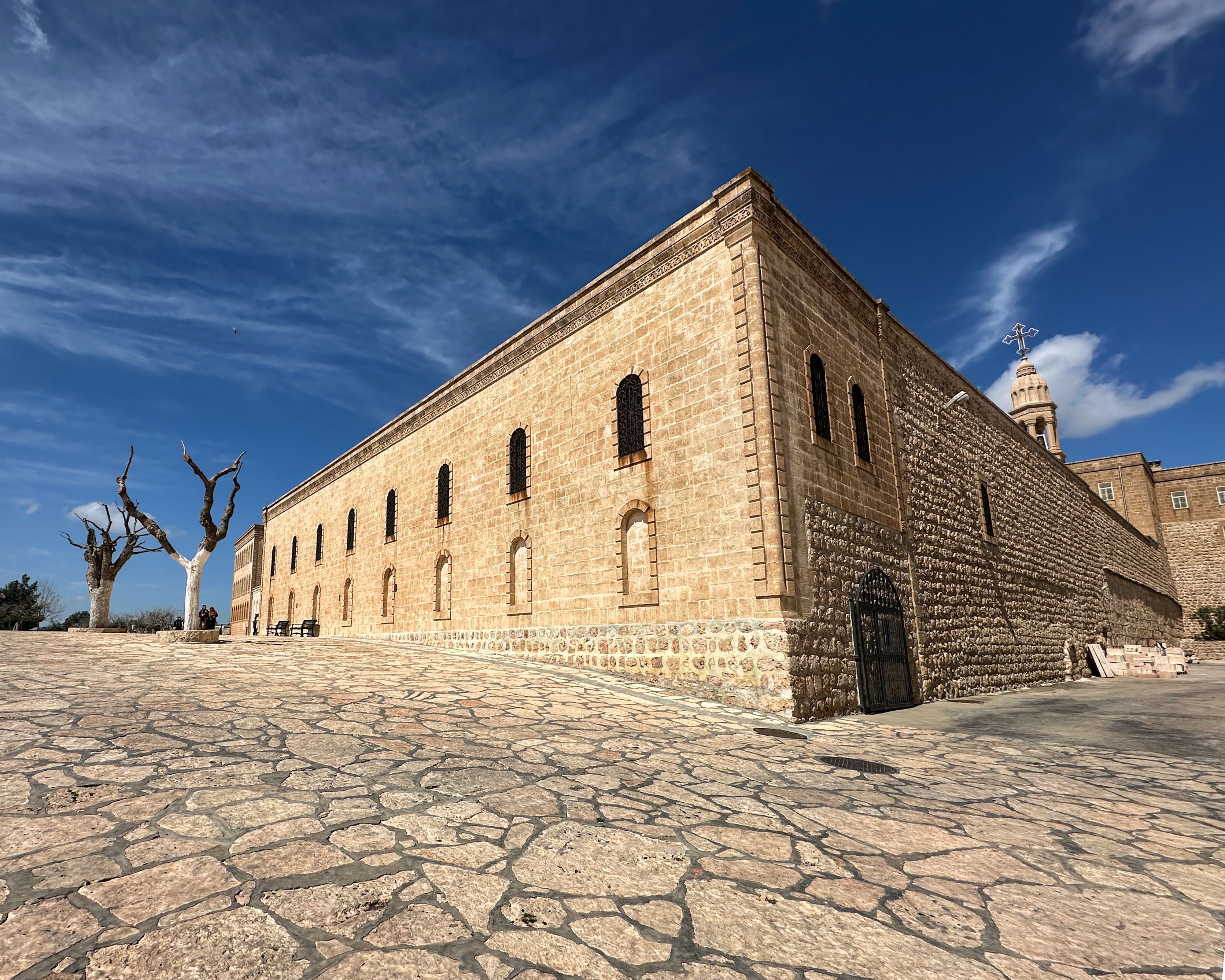 Historic Stone Building Under Blue Sky · Free Stock Photo