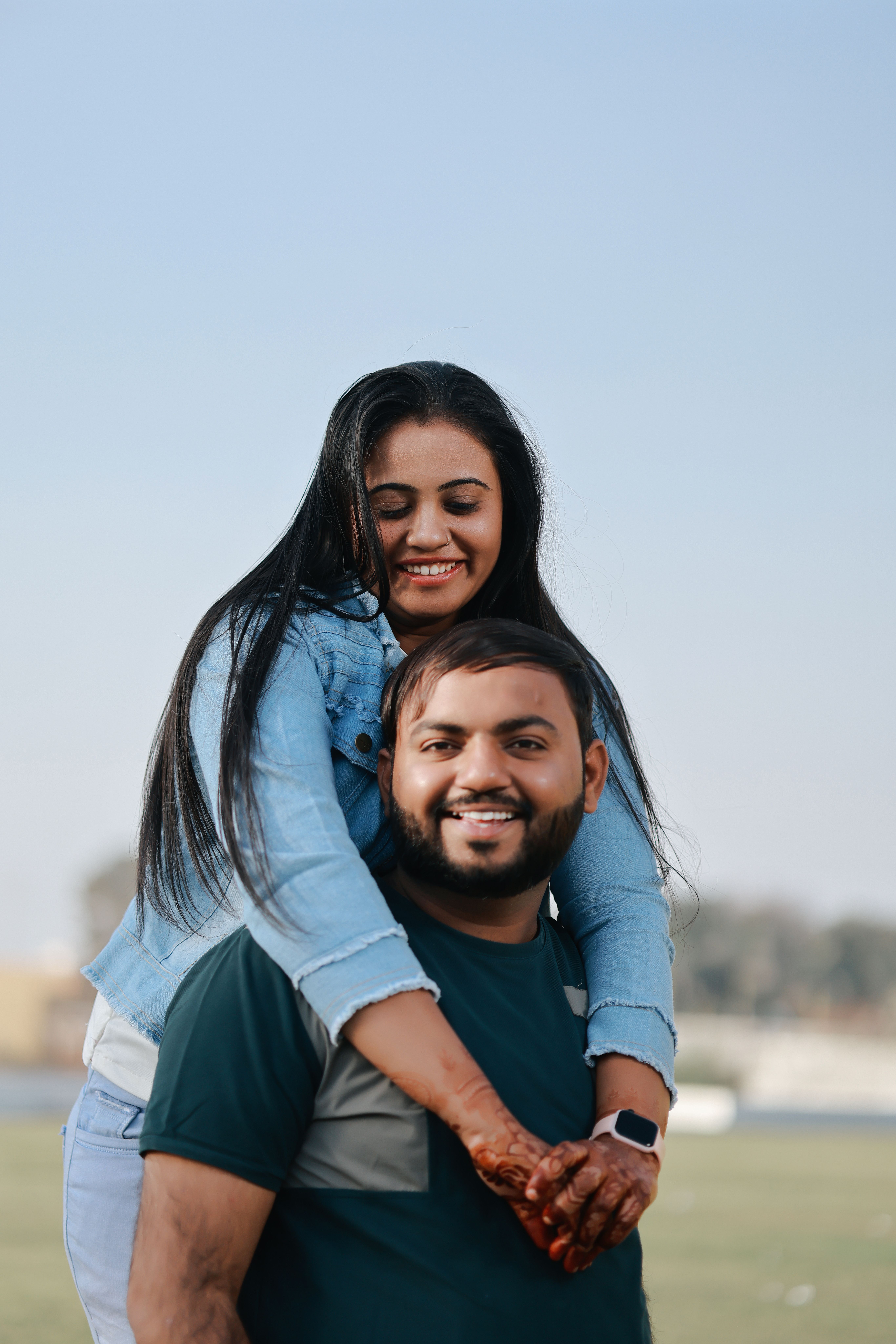 Joyful Couple Piggyback Ride Outdoors · Free Stock Photo