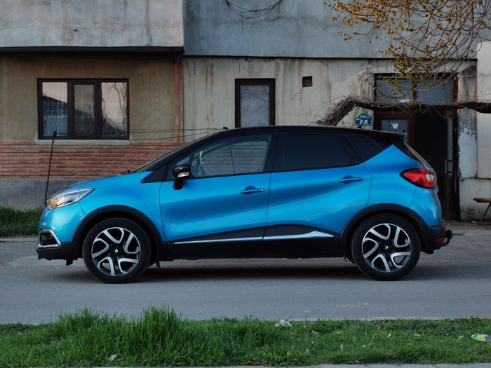 Side profile of the same blue hatchback on a quiet street — photo by FurtherMore Studio on Pexels