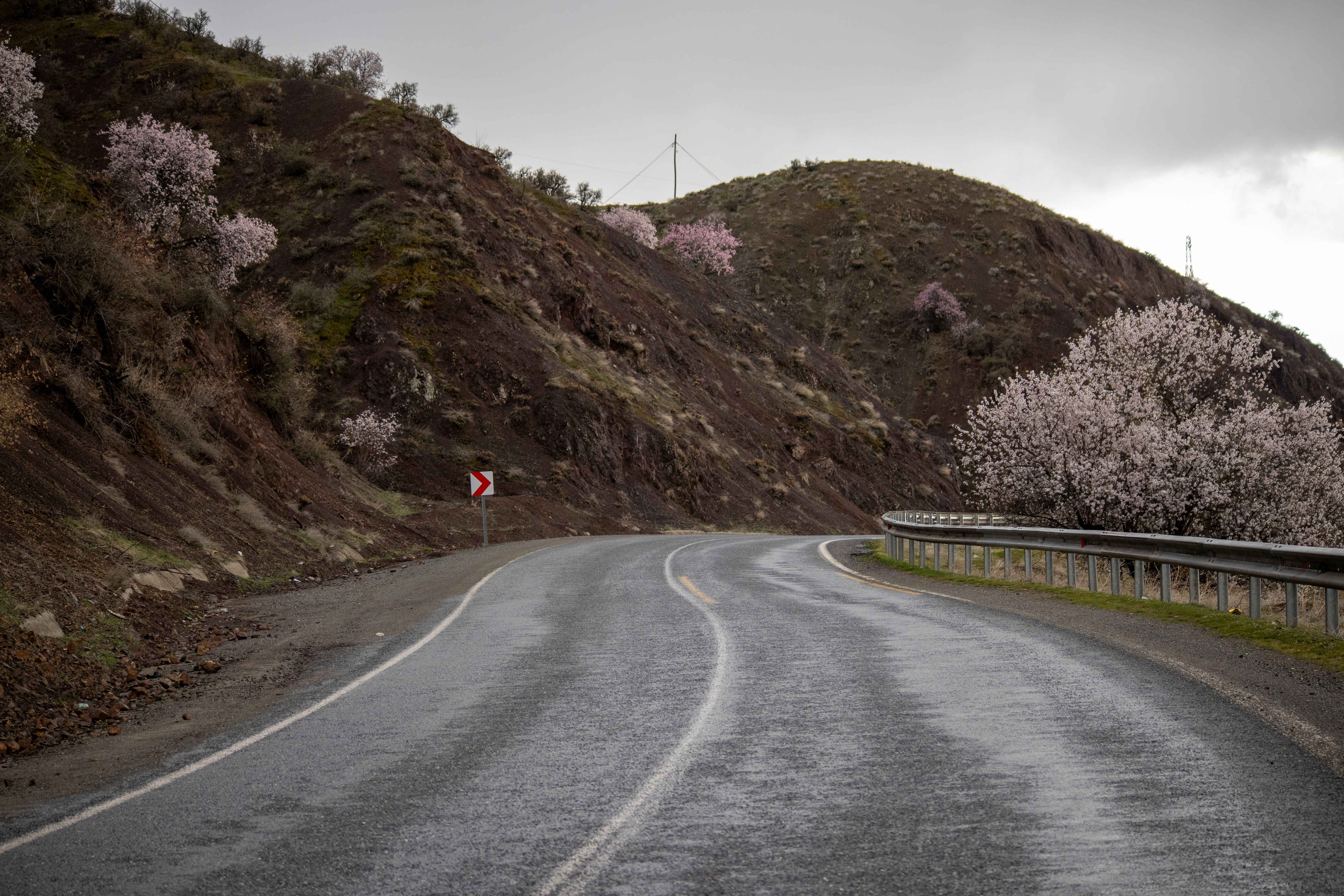 A car driving cautiously on a rural road in Azerbaijan, emphasizing road safety outside major cities