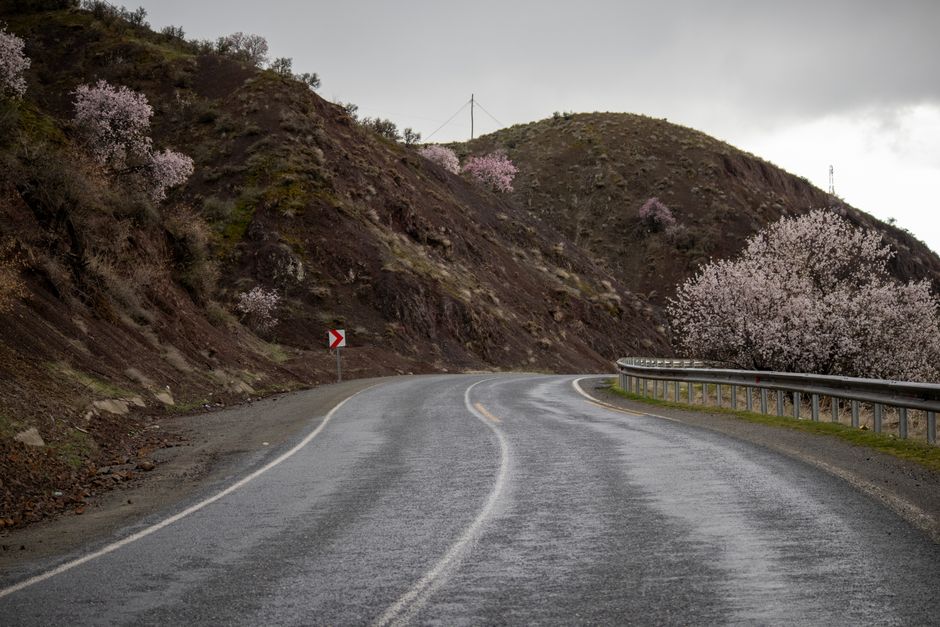 A car driving cautiously on a rural road in Azerbaijan, emphasizing road safety outside major cities