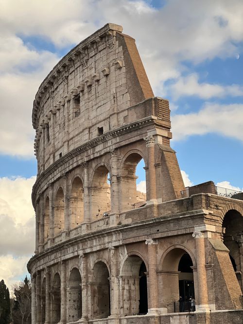 Free The iconic Colosseum in Rome, Italy, captured on a clear day, showcasing its ancient architecture. Stock Photo