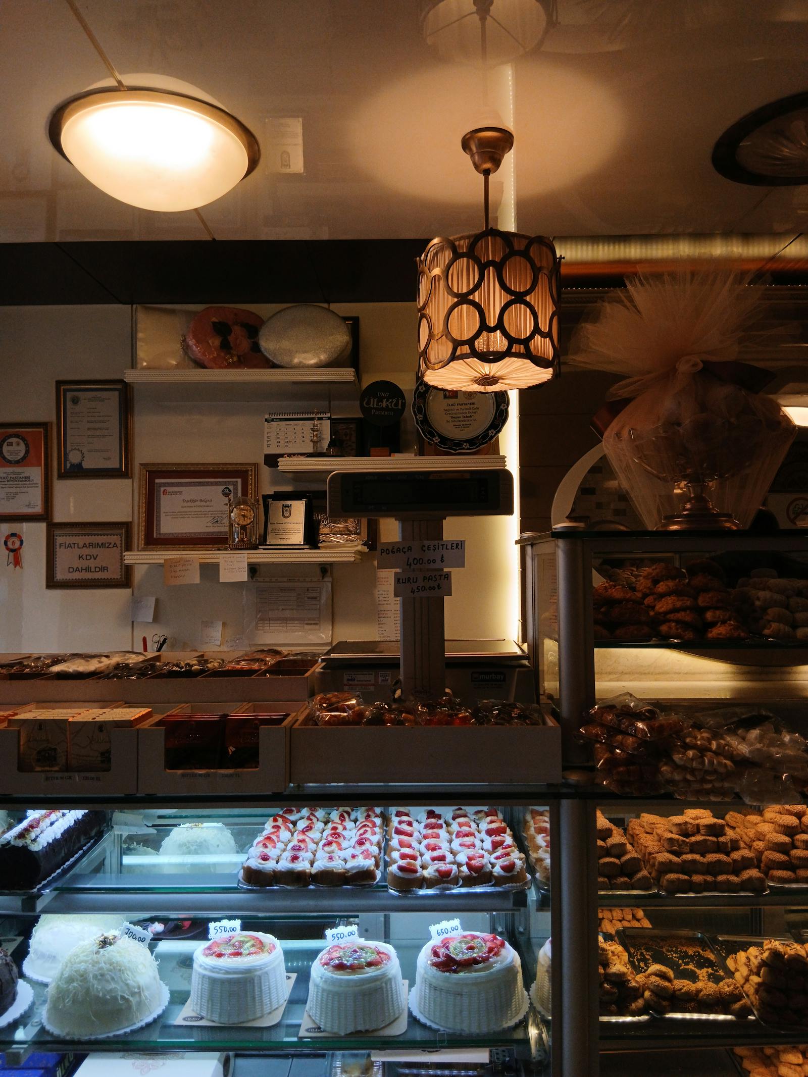 Warm bakery interior with awards and pastry counters