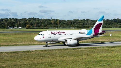 Free Eurowings Airbus A319 taxiing at Hamburg Airport on a sunny day. Stock Photo