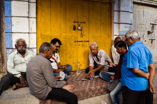 Free Elderly men playing cards on a street in Jodhpur, Rajasthan, showcasing vibrant local life. Stock Photo