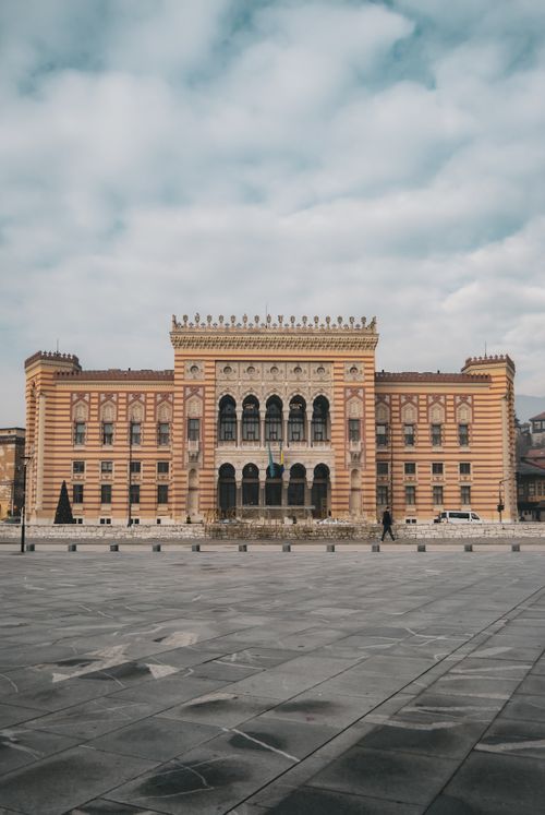 Free Capture of the historic Vijećnica Library in Sarajevo. Architectural beauty in a cityscape setting. Stock Photo