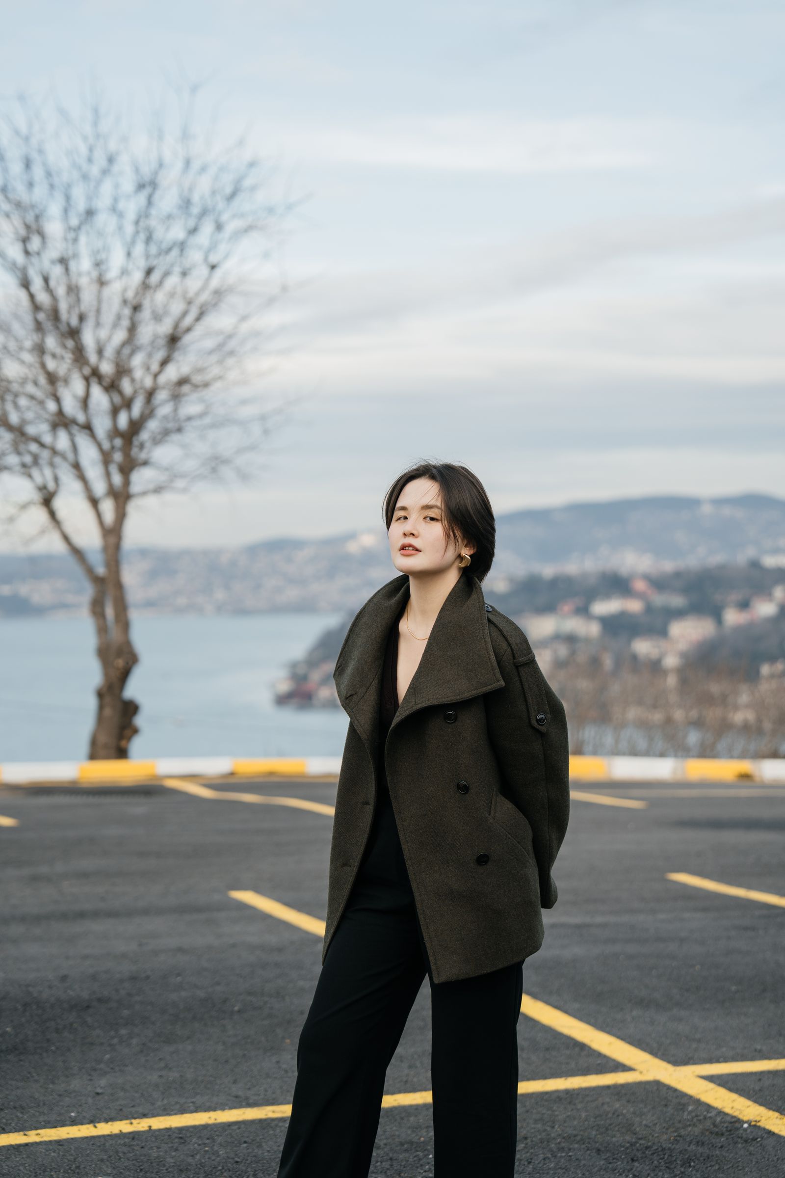Green wool coat with gold accessories for New Years Eve