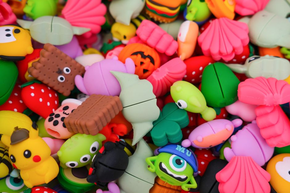 A colorful collection of various birthday freebies like cupcakes, coffee, and beauty gift boxes with a happy birthday card