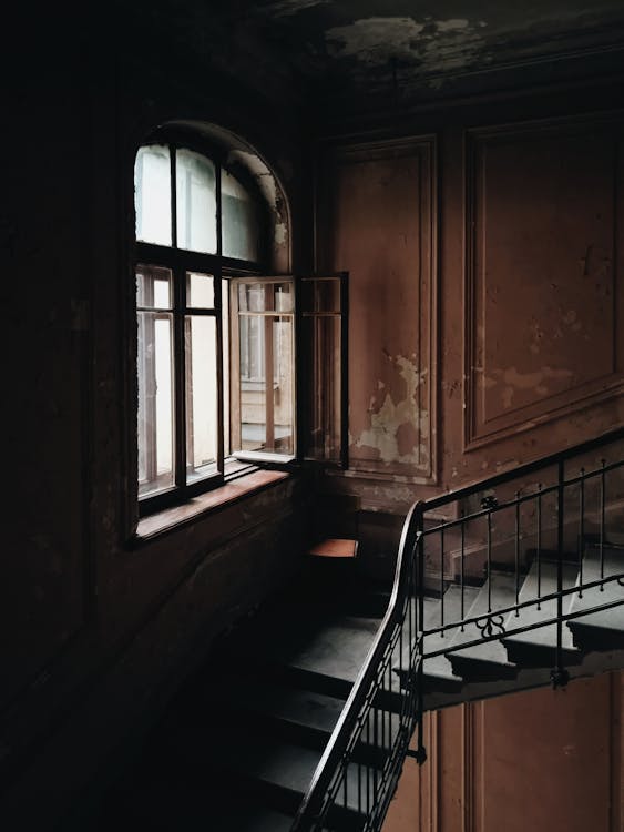Free Black and Brown Stairs Beside Window Stock Photo