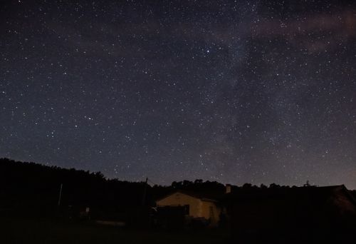 Free Tranquil night sky with stars and Milky Way over Bergerac rural landscape. Stock Photo